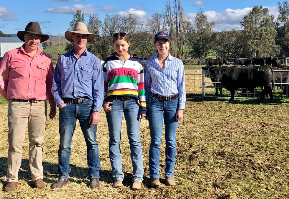 Brett Shea, Elders and Justin Keane, Corcoran Parker with Bec and Ali Bulle of Ardrossan Angus, Talmalmo. Pictured with the top-priced bull, Ardrossan Punch P444, who sold for $19,000.