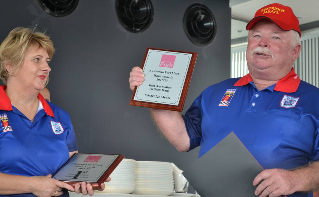 Lyn and John Yeo, Toowoomba, Queensland, with their award for best hams in Australia.The winning formula is in the wood chips used in smoking process.