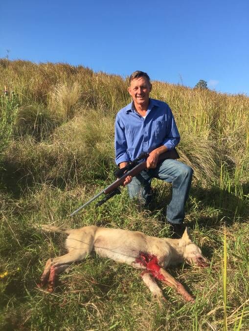 Tom Amey with the wild dog he shot this morning at Mummulgum.