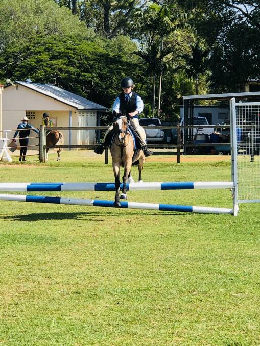 Mia competing on Angel shortly before the horse received the Hendra vaccination.