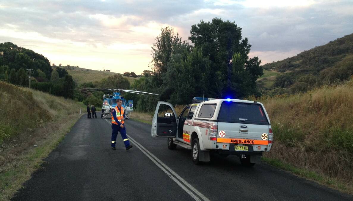 Emergency services at the scene of a crash near Tumut, where a car had run off the road.
