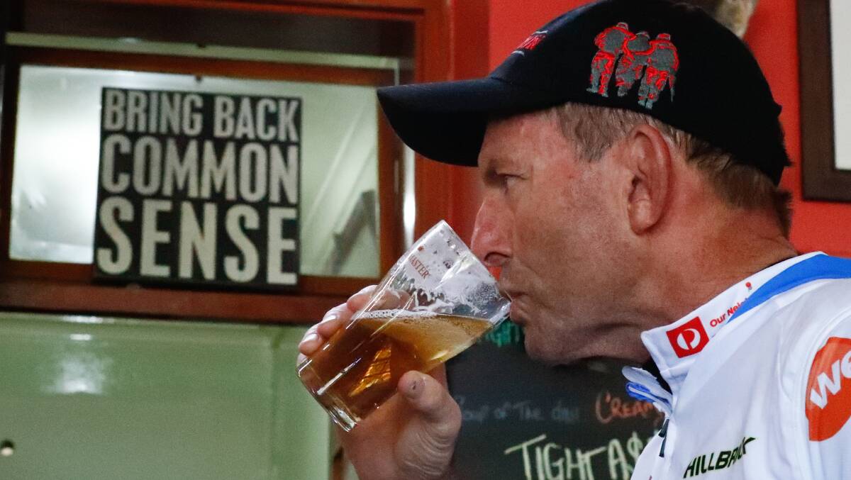 Mr Abbott sinks a beer, he prefers a shandy.