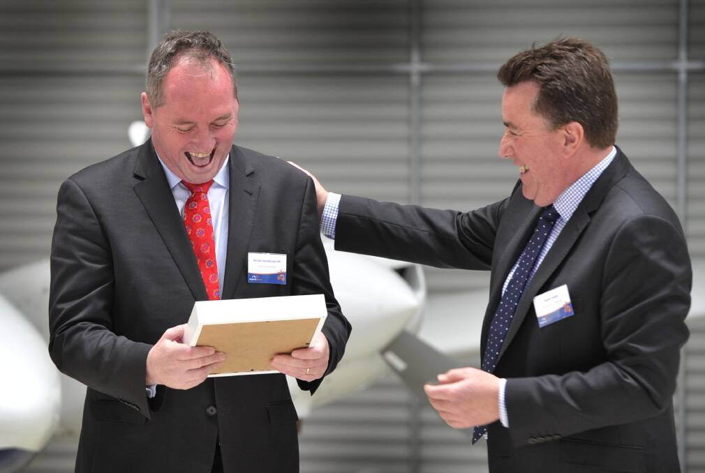 Rex Airlines boss in happier times with Agriculture Minister Barnaby Joyce when they were celebrating the graduation of Rex pilots at the airline's Wagga Wagga academy. Mr Howell says the changes to the skilled migration worker scheme, and taking pilots off the allowable list, will hurt his industry and could force the closure of regional routes and curtailing of schedules.