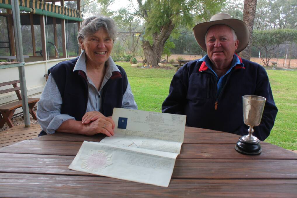 Pam and Doug Caley with one of the original title deeds to Bangate Station and the Bangate Shearers’ Cup - a reward to shearers who defied union threats in the 1890s.