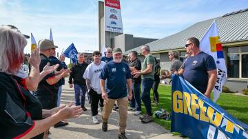 Saputo maintenance team walking off the job with support from AMWU and CEPU union members. Picture by Katri Strooband