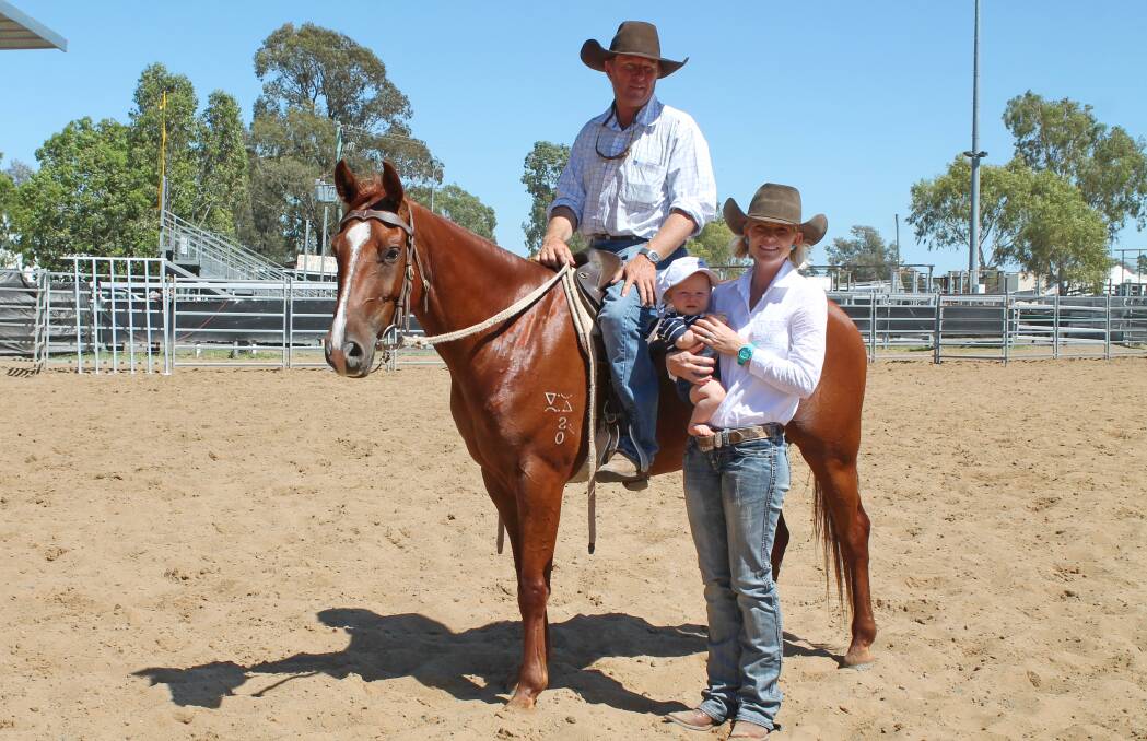 Jay and Kristin Pearce and baby Archie, Wybara, Roma, with their $15,000 top selling gelding Bungaban Barney Acres at Dalby ASH sale.