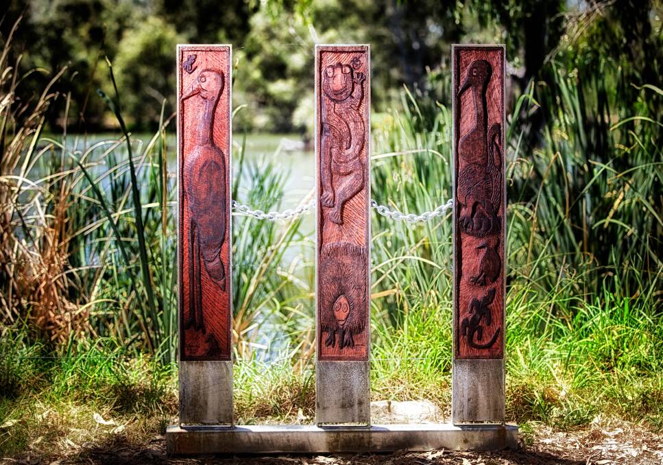 Vertical Message Sticks by Girralang Rolyat (Carmel Taylor), Wiradjuri nation feature in Yindyamarra Sculpture Walk along the Murray River at Albury.