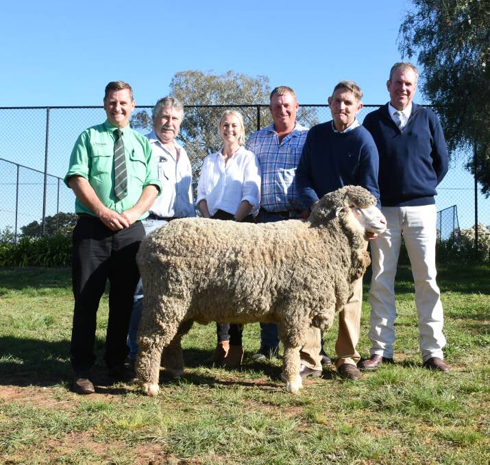 Rick Power, Nutrien Ag Solutions, Brad Cartwright, Kristen and Anthony Frost, Thalabah, Steve Phillips, Yarrawonga Merinos and auctioneer Paul Dooley, Paul Dooley Pty Ltd. 