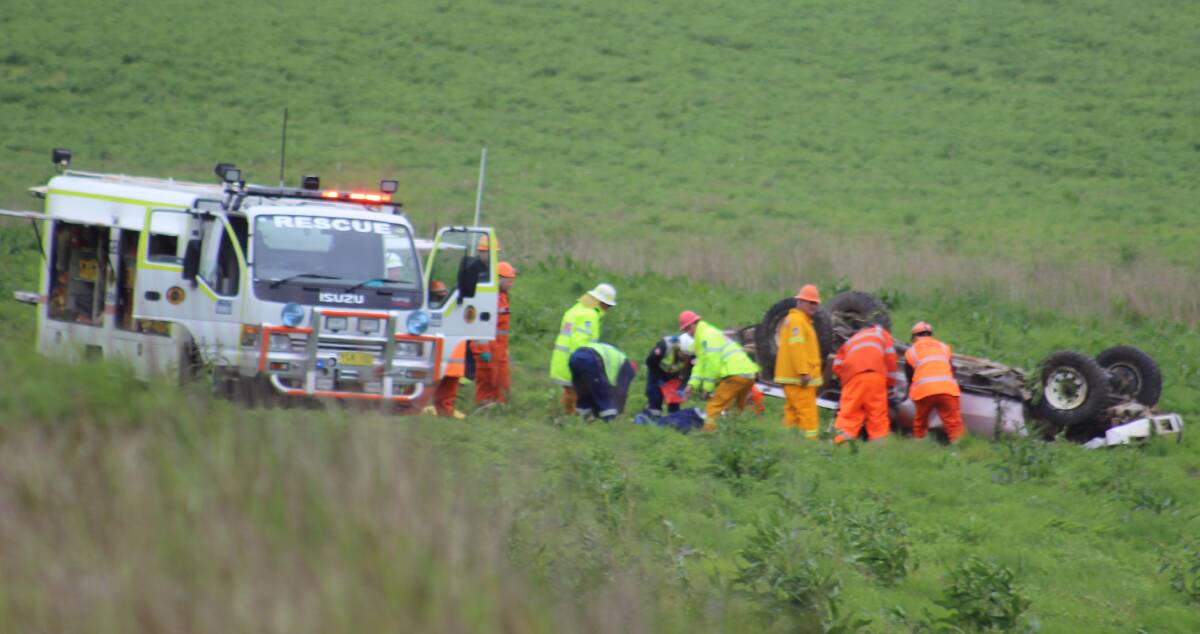 CRASH: Emergency services at the scene of Saturday's crash at Gilmandyke, south of Bathurst. Photo: TOP NOTCH VIDEO
