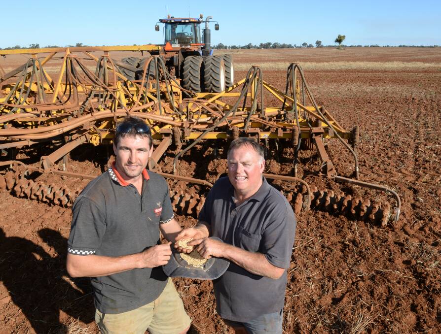 Trent Usher, "Rosewood", Tullamore, and father in-law Mick Monkerud, in action sowing their wheat crops after dry sowing 240 hectares of Victory canola in late April. 