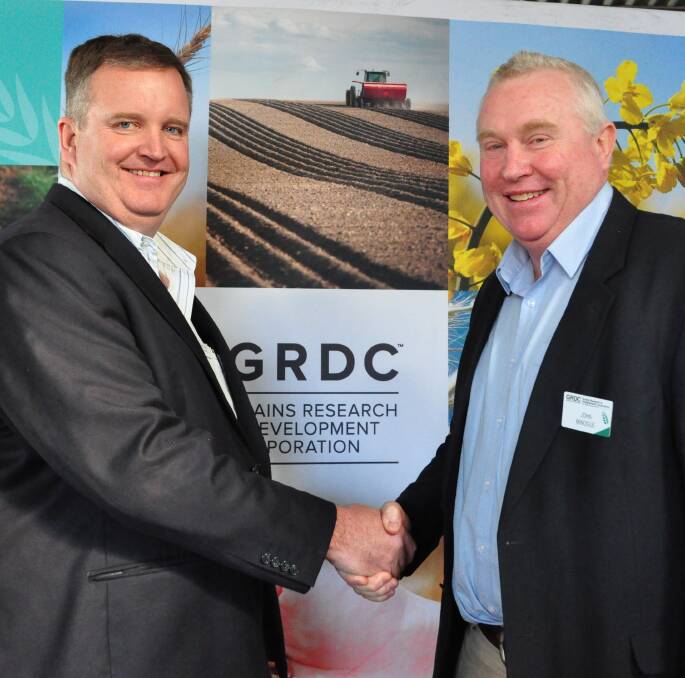 James Clark welcomes John Minogue to the northern panel chair at the GRDC grower insights breakfast at AgQuip.