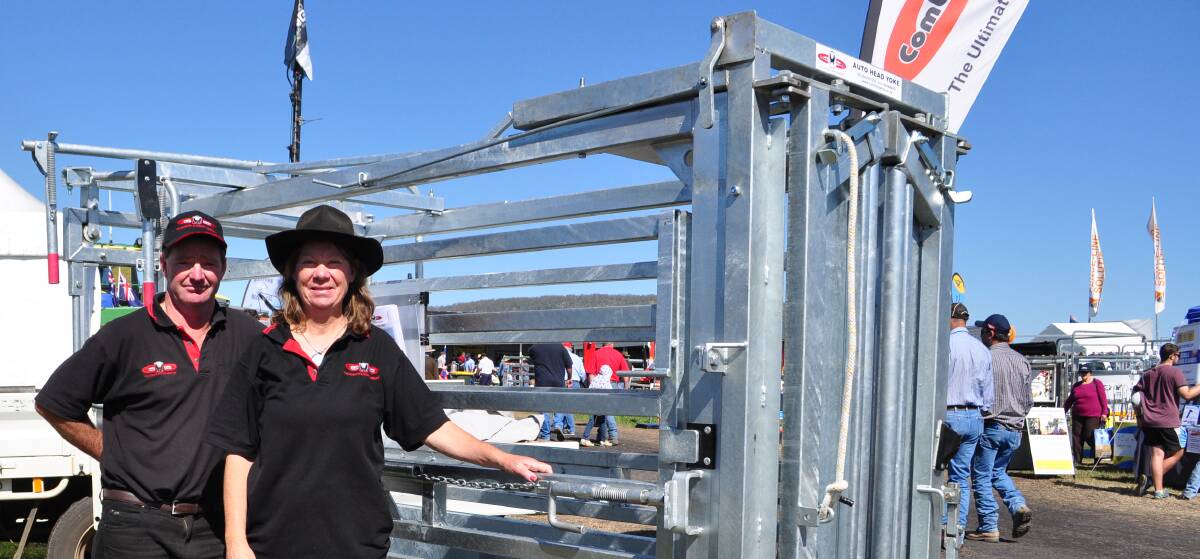 Owners and designers of the Combi Clamp, Wayne and Lynley Coffey, with the cattle gear  built tough and designed for a safe, easy one-person operation.
