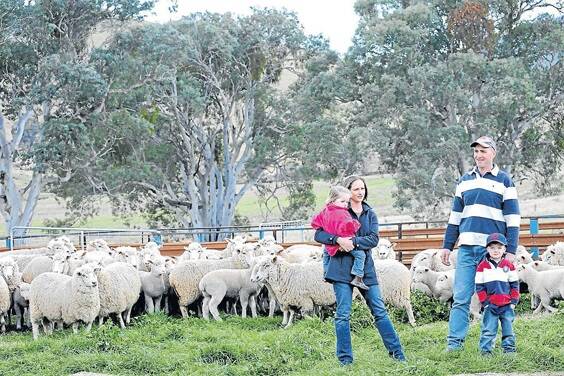John Webster, with wife Kerri and children James, 5, and Sophie, 2,  Webster Pastoral Company, turn off about 15,000 second-cross prime lambs each year.
