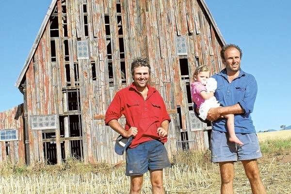 Julian and Sam Craig with his daughter Zahra in front of Superman's barn at "Umagarlee", Breeza.