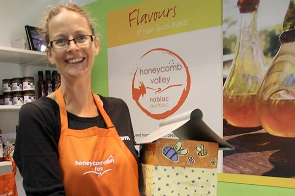Anna Campbell from Honeycomb Valley Farm at Nabiac sometimes found her stand under siege as buyers crowded for samples of the exotic Sugarbag Bee honey.