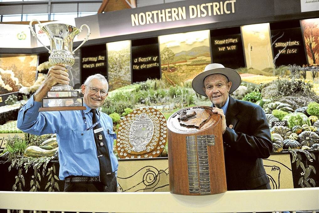 Northern’s manager Arthur Johns, Richmond Hill via Lismore, is pictured (right) holding the People’s Choice trophy, with team member Gerard Van Den Broek, Mullumbimby, holding the Woolworths Display trophy.
