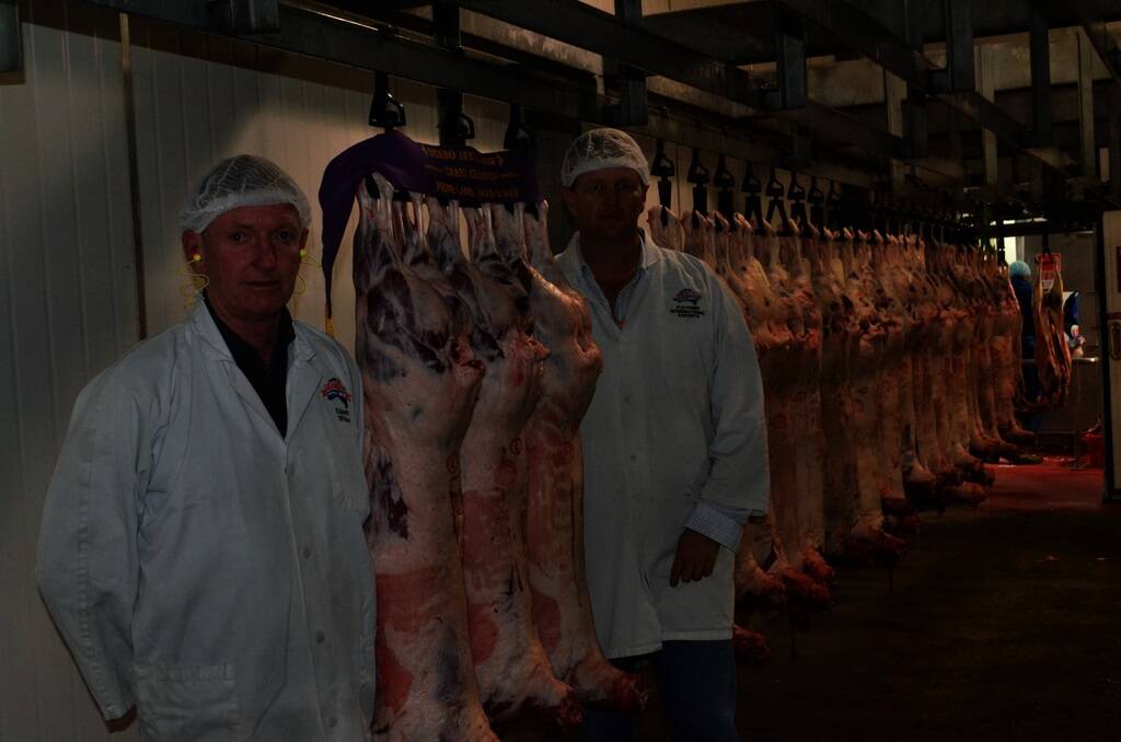 ABOVE:?Grand champion combined hoof and hook exhibitor Stephen Cresswell, Annalara White Dorpers, Dubbo,and Terry Mitchell, prime lamb hoof and hook commitee, Dubbo, with the carcases being judged at the Fletchers International abbatoir, Dubb, on Tuesday.
