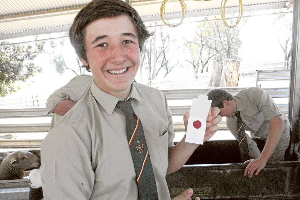 Farrer High Year 11 student Angus Wolfgang-Wicks with a Sheep CRC blood card ready for analysis.