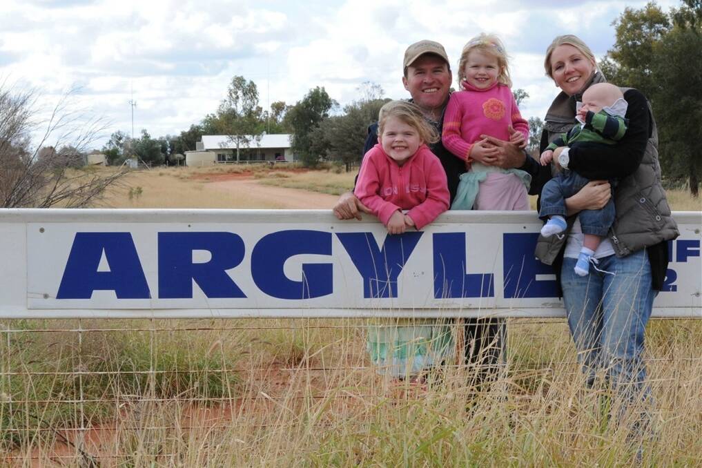 Mike Rosser with children Ellie, 5, Ava, 3, Harry, four months, and wife Lucy at Argyle Station, Wanaaring.