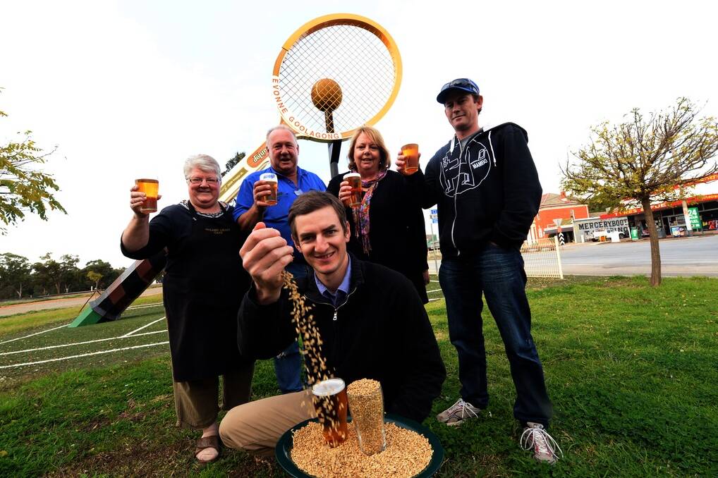 Community members Beth Preston, Golden Cafe, Kevin and Louise Milligan "Glenora" and Commercial Hotel Publican Brent Danaher join Stuart Whytcross to promote Barellan district Barley for Beer brewing.