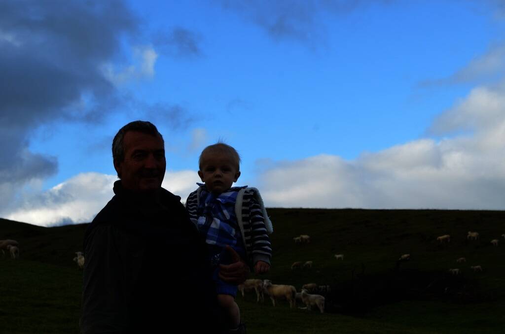 Graham Armore, Marelma, Gundagai, with his grandson Chase and Australian White lambs.