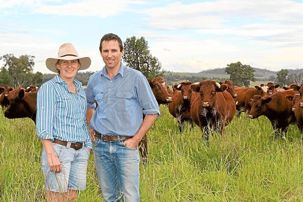 Kirrily and Derek Blomfield with cattle on their Caroona property, “Colorado”.
