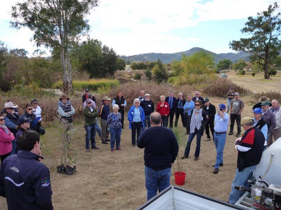 Participants at a previous Fishers for Fish Habitat Forum learning about riverbank restoration techniques.
