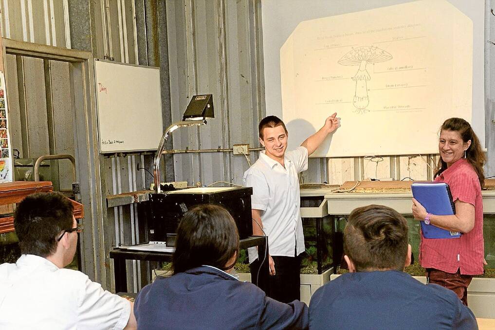 Crestwood High School agriculture teacher Robbie Ashurst (right) and Year 11 student Lachlan O’Brien during a class.