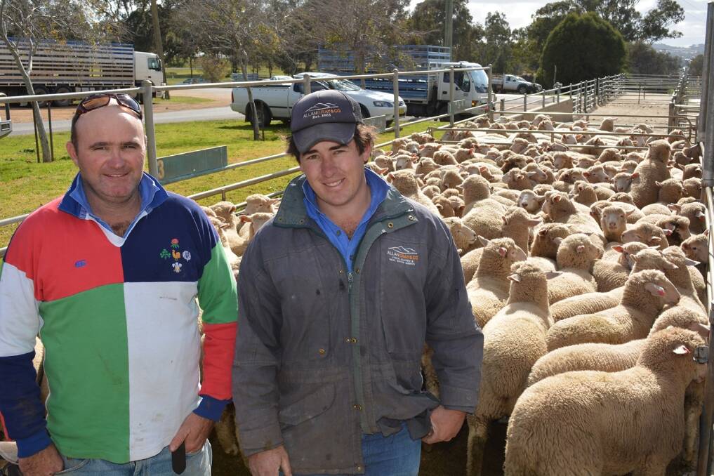 Brendan Nash, "Cranbury", Cudal, with his agent Chris Chalker, Allan Grey and Company, Cowra, sold three- and four-month-old, second-cross new season lambs for $124 at the Cowra prime sheep sale last Friday.