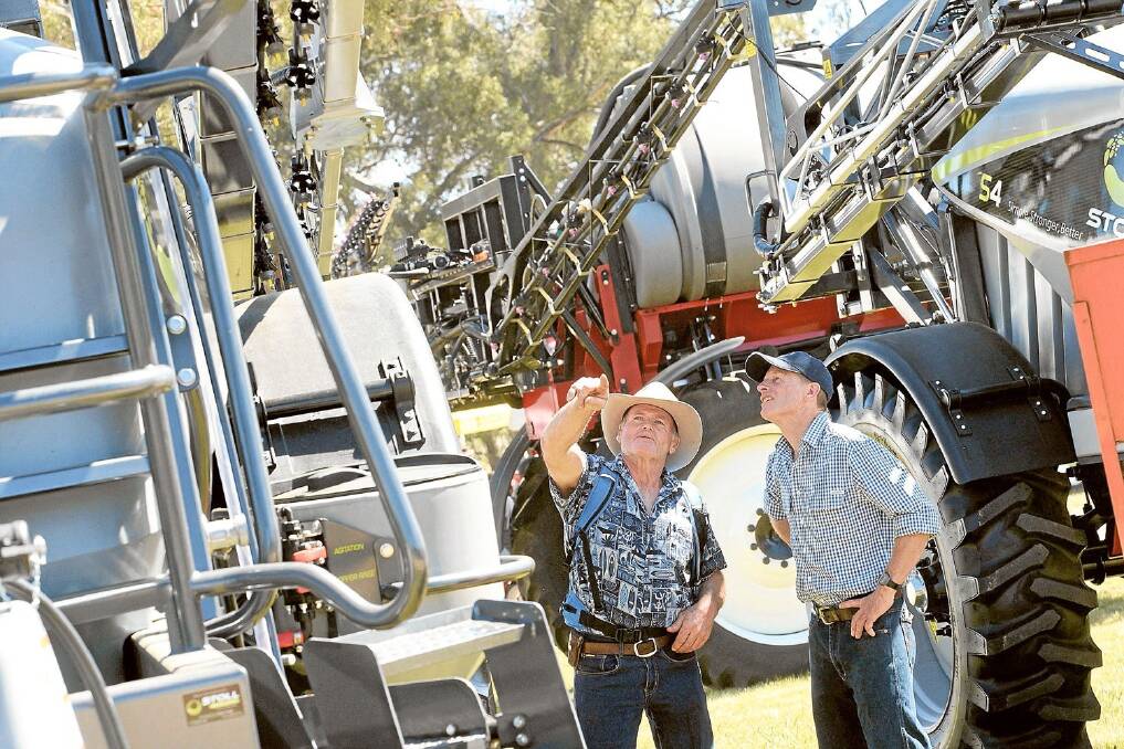 Mount Mulga Pastoral Company manager Andrew Cumming, West Wyalong, and owner Richard Davis (both pictured), bought a Stoll Boomspray at the Henty Farm Machinery Field Days.