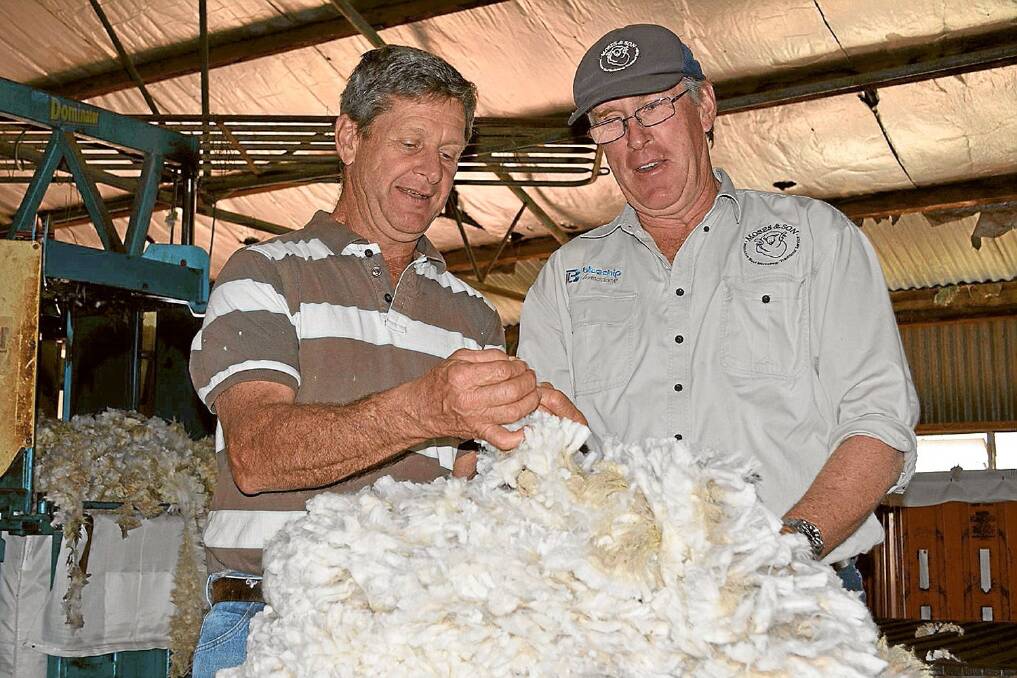 Moses and Son branch manager David Payne, Wagga Wagga, with shearing contractor and wool classer John Evans on Mark Quilter’s property, “Belalie”, Sandigo, near Wagga Wagga.