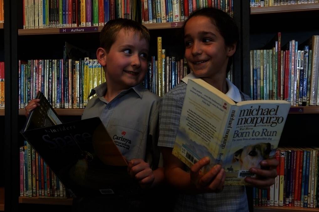 Carinya Christian School, Calala, Year 4 students Nathan Carter, 10, and Sami Wilkin, 9, in the school's library.