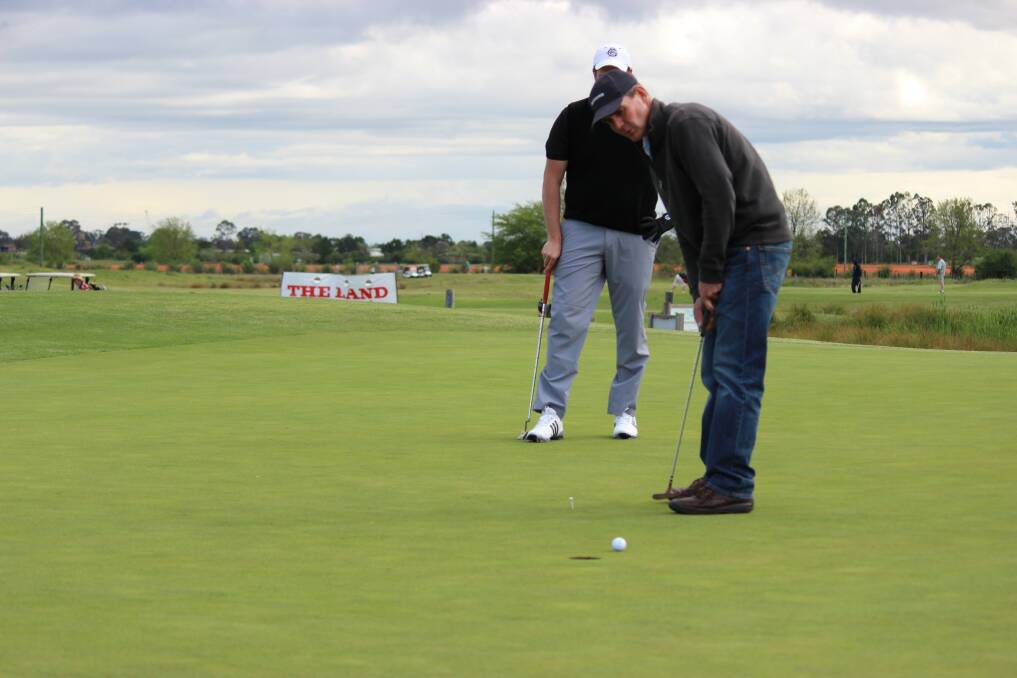 Phil Morrow, CRT The Rural Centre, Orange, watches his putt closely at the challenging Lynwood Country Club course.