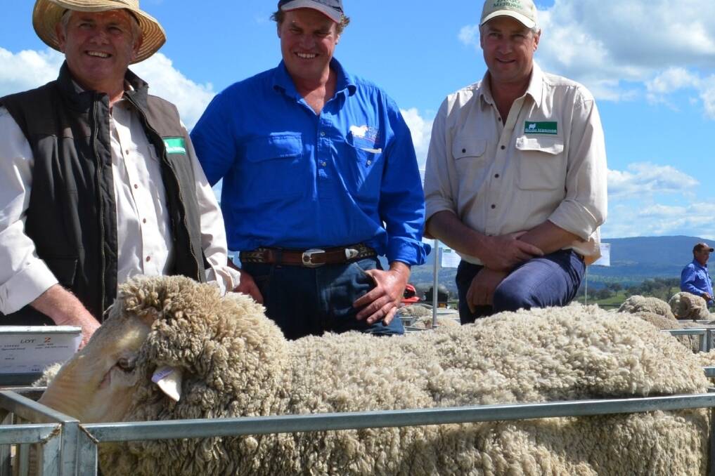 Mal Peake, stud manager Bogo Merino stud, Craig Wilson, Craig Wilson Livestock, Wagga Wagga and Matt Crozier, general manager Cavan Station, Yass owner of Bogo Merino stud with the top priced ram at the 2014 on-property sale