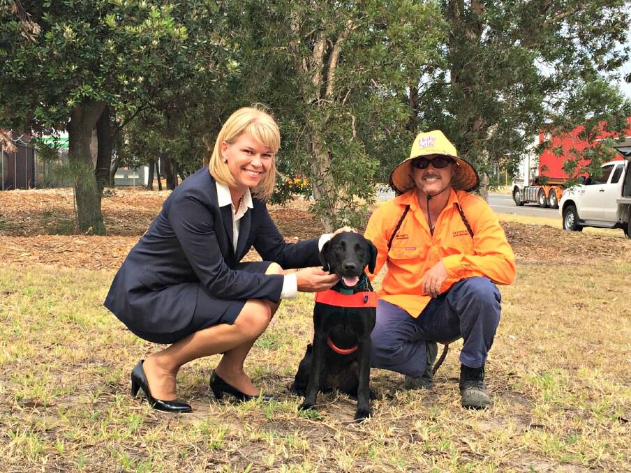 NSW Minister for Primary Industries, Katrina Hodgkinson, meets “Willow” the elite odour detection dog and her senior handler form Biosecurity Queensland, Justin Gibson, at the Port Botany site yesterday.  