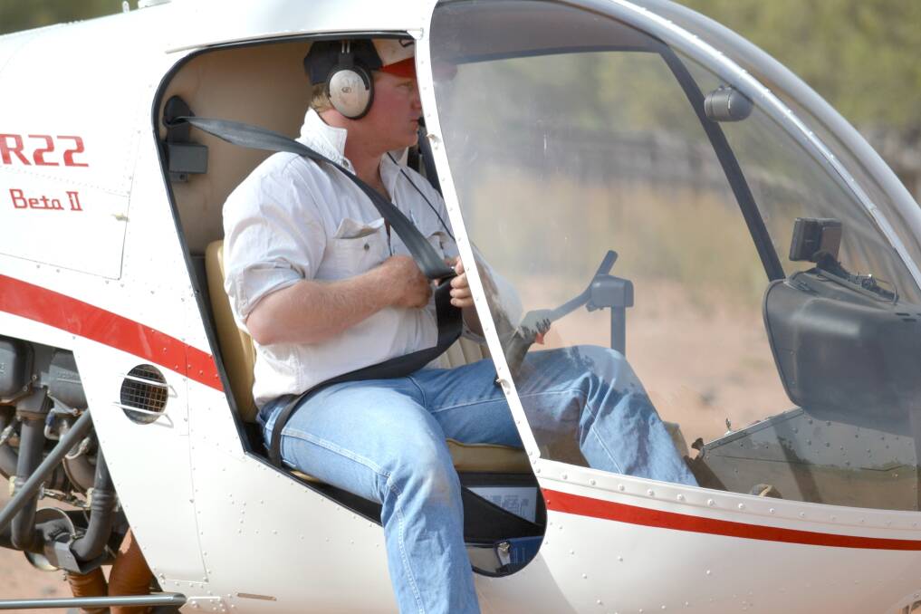Dan Muenster lands his Robinson R22 helicopter after mustering goats on “Congarrara”.