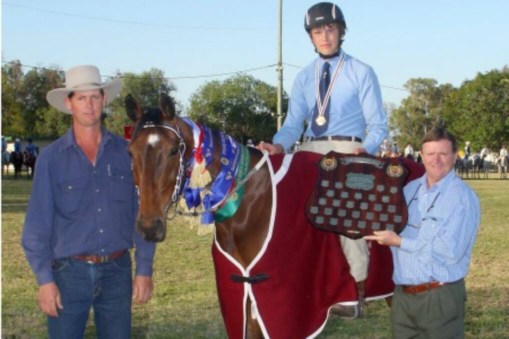 Clifton Davis receives the Ted Toohill Shield for highest point score over all age groups at the Queensland State championships last year.