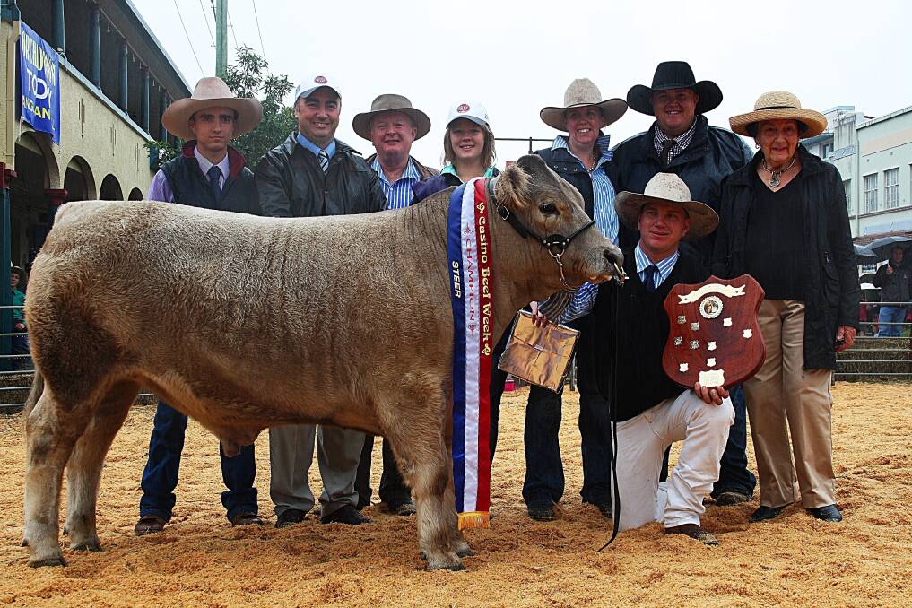 Champion led steer of the 2014 Casino Beef Week, a Murray Grey owned by Mitchell Dandus, left, and James and Jane Dockrill (holding the shield and behind), with Beef Week president Stuart George, Chris Dockrill, Beef Week Queen Brooke Hancock, judge Travis Luscombe and Margaret Noble, who presented the shield in honour of her late husband.
