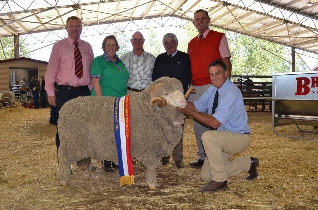 John Newsome, Elders stud stock, buyers Janet and Tony Gall, "Wilson's Creek", Uralla, Australian Wool Network territory manager Peter Meakes, Newcastle, Andy McGeoch, Elders stud stock Dubbo, and Alfoxton stud principal Chris Clonan with the top-priced housed ram which sold for $8500.