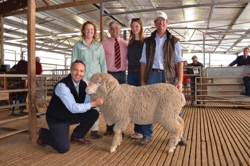 Vendors Martin and Cecilia Oppenheimer, Elders district wool manager for New England Tom Henry, and buyers Eugenie and Kim Barnet with the top-priced ram which sold for $4600.