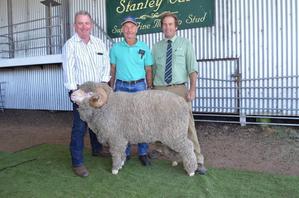 Stanley Vale stud principal Tim Bower, buyer Don Edmonds, "Muswell Hill", Kentucky, and Angus Carter, Landmark northern region, with the top-priced ram which sold for $1400.