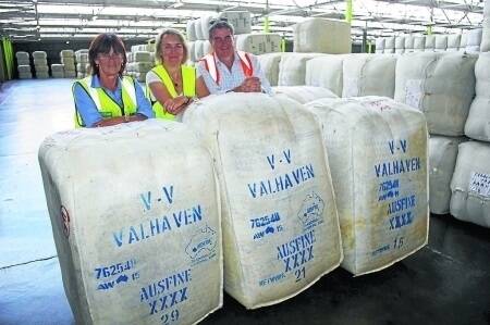 Australian Wool Handler Goulburn operations manager Sharyn Gospel with Lorna and Paul Vallely, "Cladymore", Fullerton near Bathurst, with some of their bales of wool sold at the Sydney Royal wool auction.