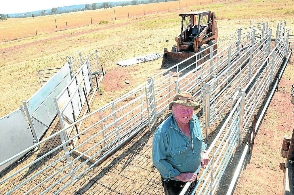 Neil Doherty waits for concreters to pour the flooring of the bugle, drenching and drafting races in his new set of Atlex sheep yards being constructed on â€œAllingtonâ€, Toongi, to easily work 1000 sheep at a time.