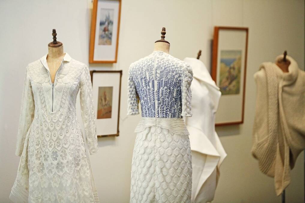 Some of the garments and artwork featured in the exhibition.