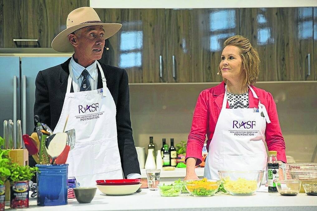 Bill Daly receiving the kitchen from the Royal Agricultural Society Foundation executive officer Kate Ross.