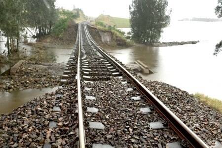 The rail line at Tocal (pictured above and below) was crippled when floodwaters completely undermined its footings. Pic: Dr Cameron Archer.