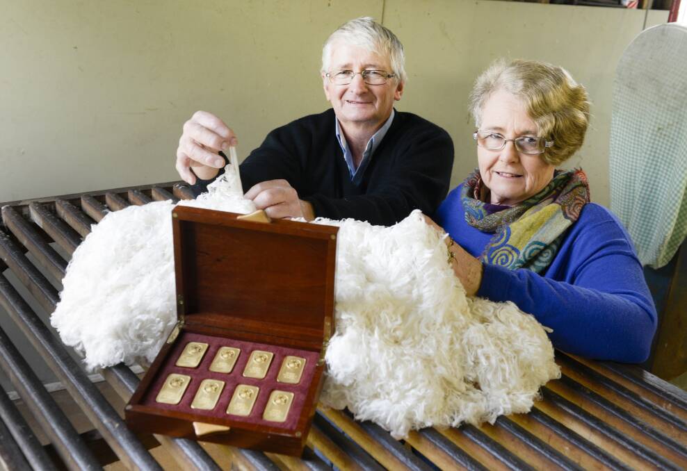 David and Susan Rowbottom with their golden prize and winning fleece.