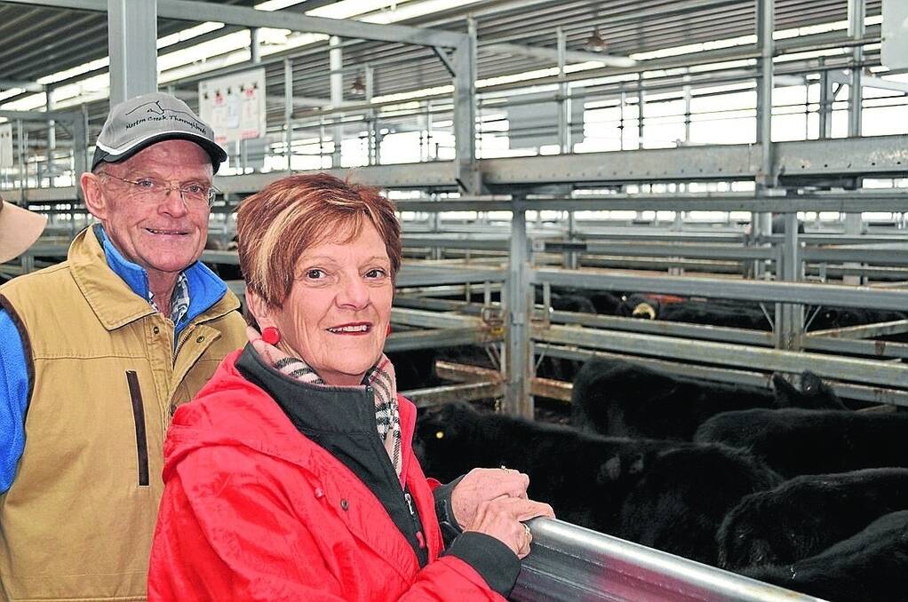 Peter and Pam Wallace, "Culverley Rise", Bungowannah, with their pen of nine Angus steers weighing 305 kilograms that sold for $885 at Wodonga last Thursday.
