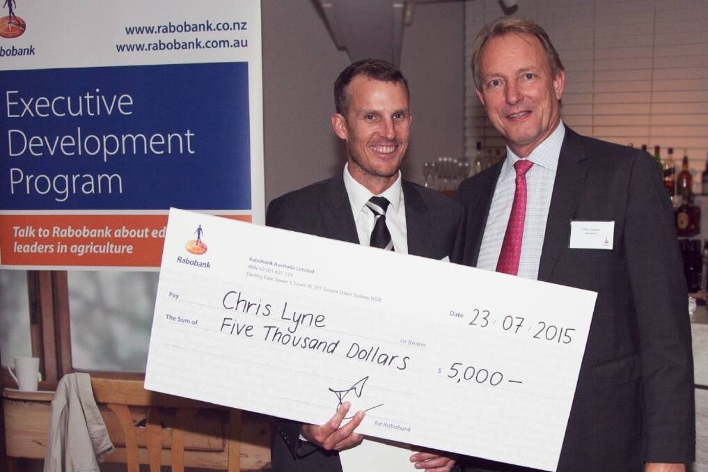 Winner of the Rabobank Executive Development Program, Chris Lyne, Ayr Farming, Ayr, Queensland, is presented with the winner's cheque by Rabobank Australia chief executive Thos Gieskes.