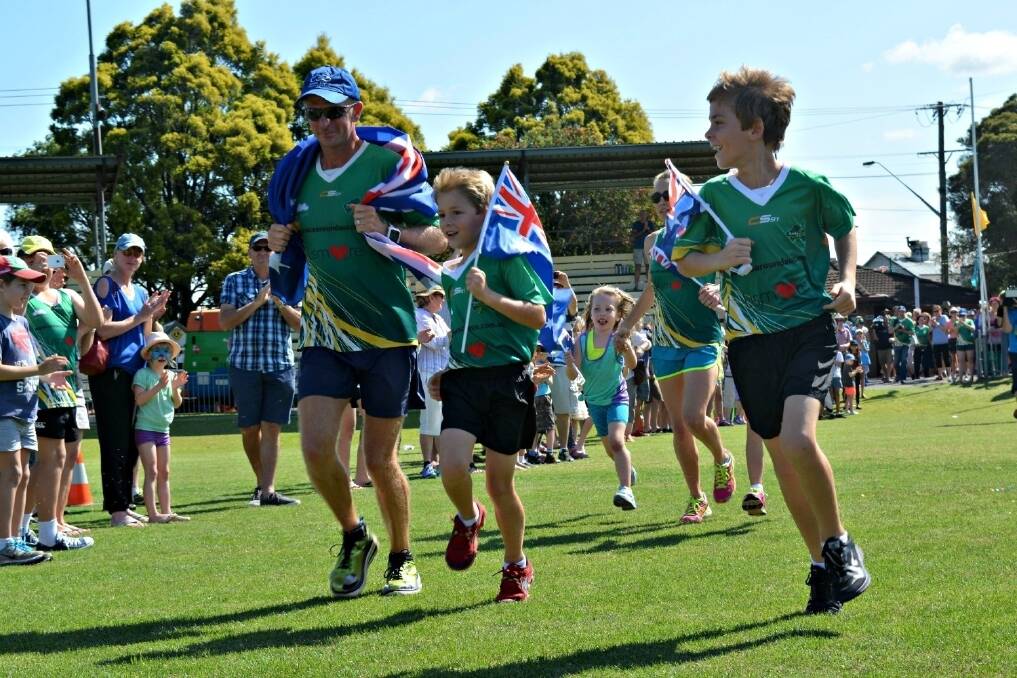 Record-breaking marathon runner Dave Alley races to the finish line at Lismore's Oakes Oval on Sunday.  
